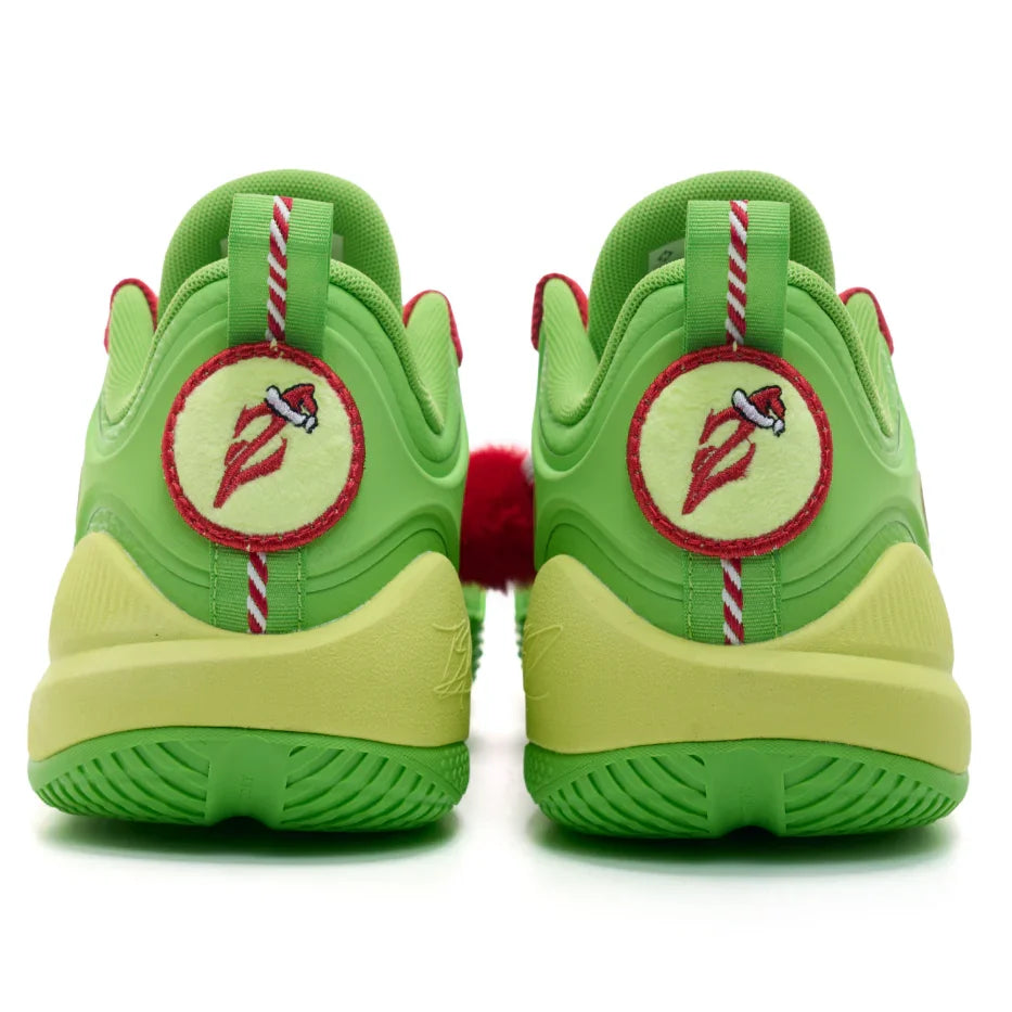 Green and yellow sneakers with a red and white logo on a white background